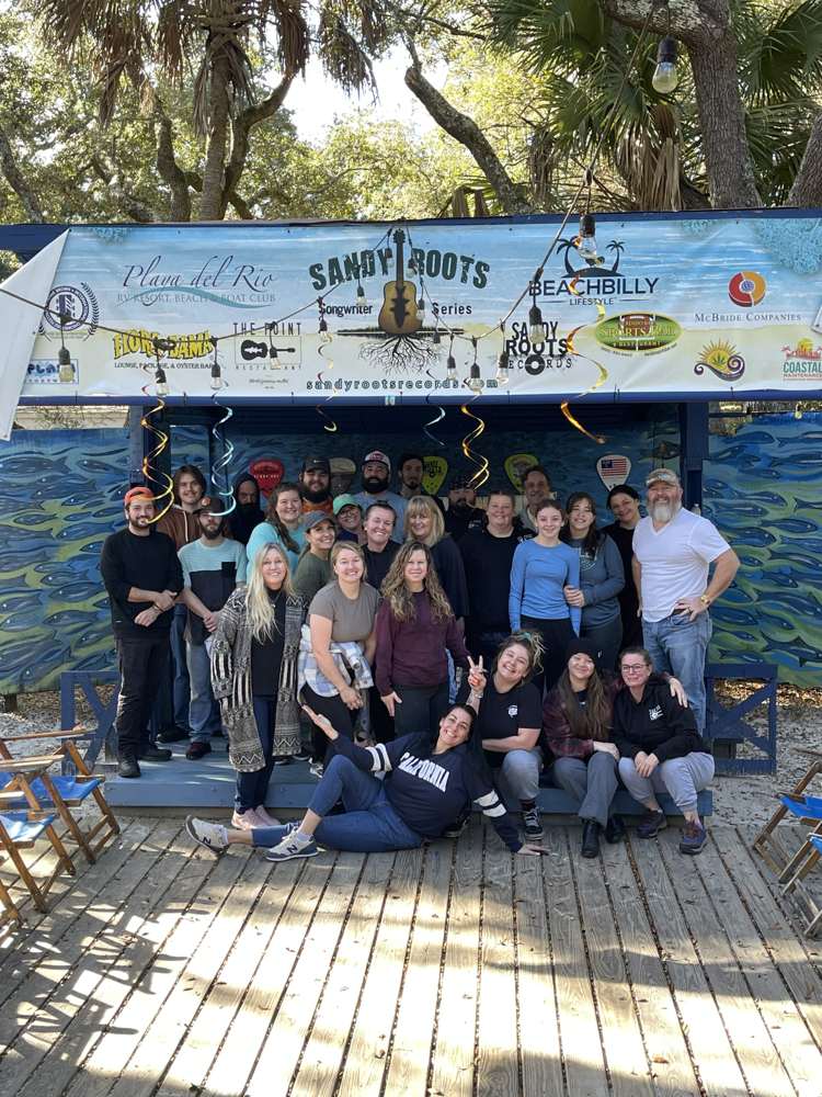 The Point Restaurant staff gathered on the Courtyard stage in Perdido, FL